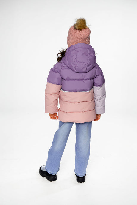 Back view of a child in the violet and peach jacket with the hood down and a pom-pom hat