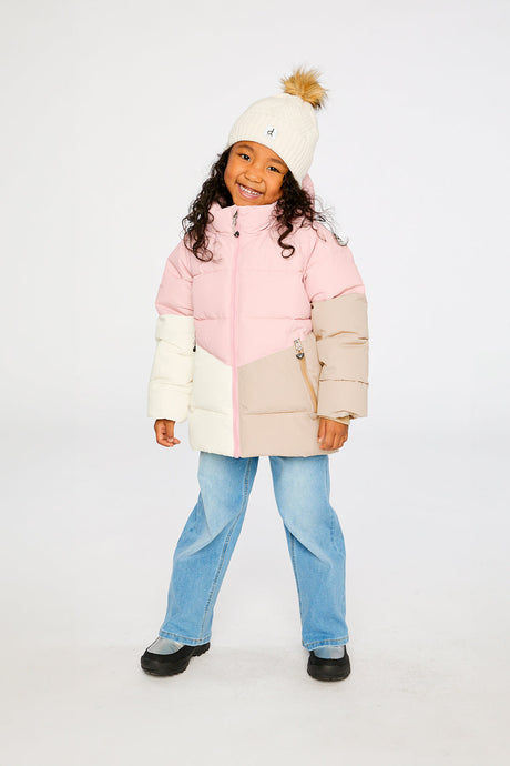 Child wearing the Deux par Deux pale dusty pink color-block winter jacket with a cream pom-pom hat, front view