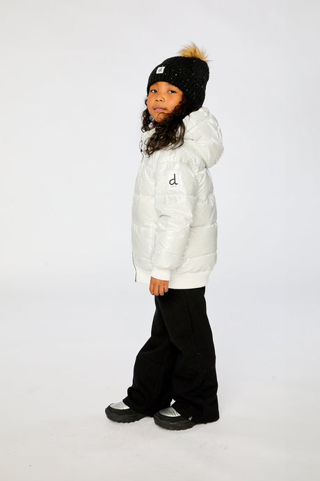 Child wearing the white glitter puffer coat, side view