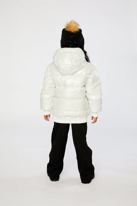 Child wearing the white glitter puffy winter jacket, back view