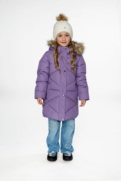 Child wearing the long violet Deux par Deux puffer jacket with a faux-fur hood and cream pom-pom hat, front view