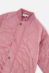 Close-up of the ribbed collar, snap front and heart-shaped quilting on the mauve pink jacket