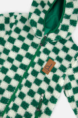 Close-up of the green and cream check sherpa, zipper and brand label