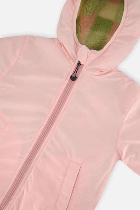 Close-up of the pale dusty pink coated side, zipper and hood