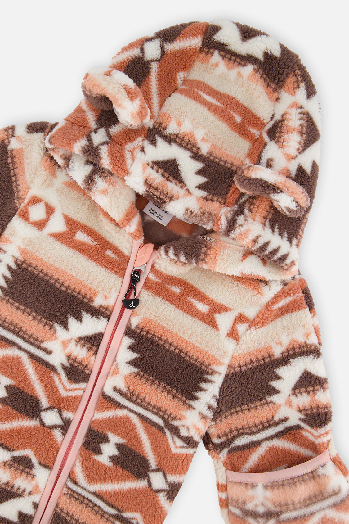 Close-up of the Aztec pink plush with the pink zipper, chin guard and eared hood