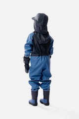 Child in the Deux par Deux blue colorblock rain one-piece, lifestyle photo
