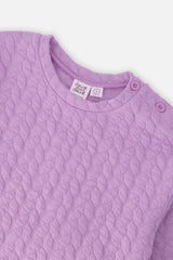 Close-up of the Jacquard Sweatshirt Purple neckline and shoulder buttons