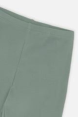 Close-up of the vertical rib texture and waistband on green leggings