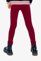Child wearing the Deux par Deux burgundy rib leggings, back view