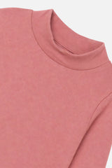 Close-up of the mock neck collar and brushed rib on the pink top