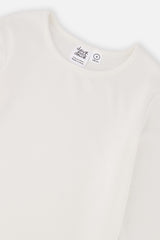 Close-up of the crew neckline on the off-white brushed rib top