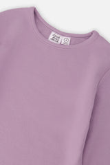Close-up of the crew neckline and vertical rib on the violet top