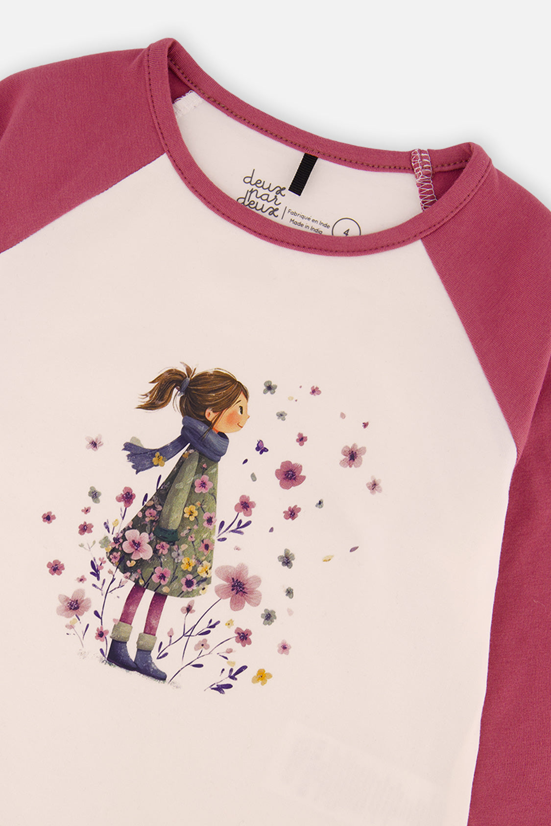 Close-up of the girl and flowers graphic on the white front