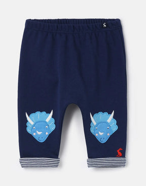Joules Grove Navy Dinosaur Character Pants: front view with dinosaur faces at the knees