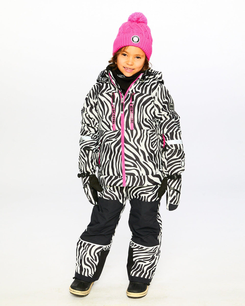 Lifestyle photo of child in Deux par Deux zebra snowsuit – order before sizes run out