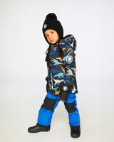 Lifestyle photo of child wearing Deux par Deux blue chill snowsuit outdoors