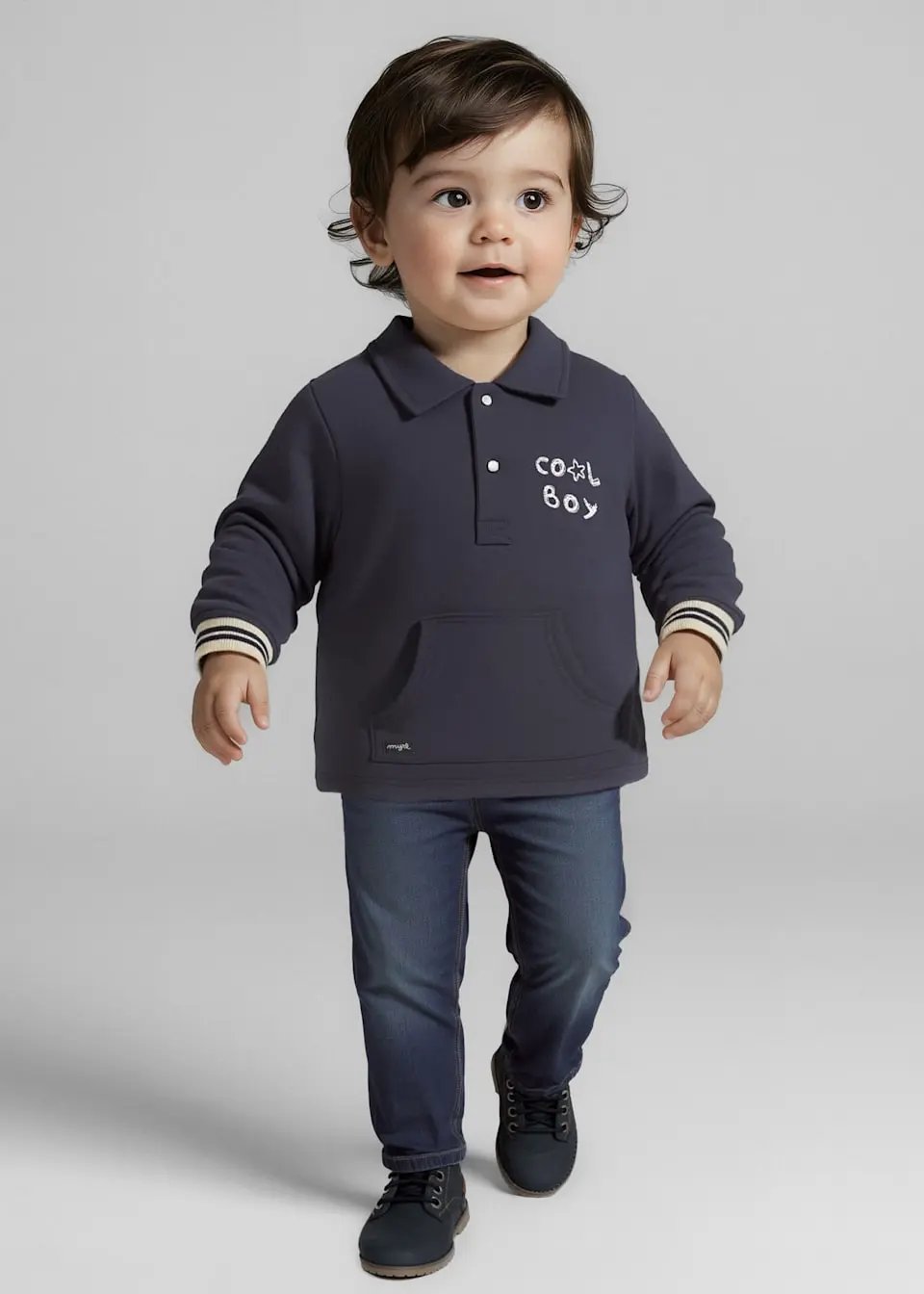 Lifestyle shot of baby boy wearing jeans, showing slim fit and comfy stretch.