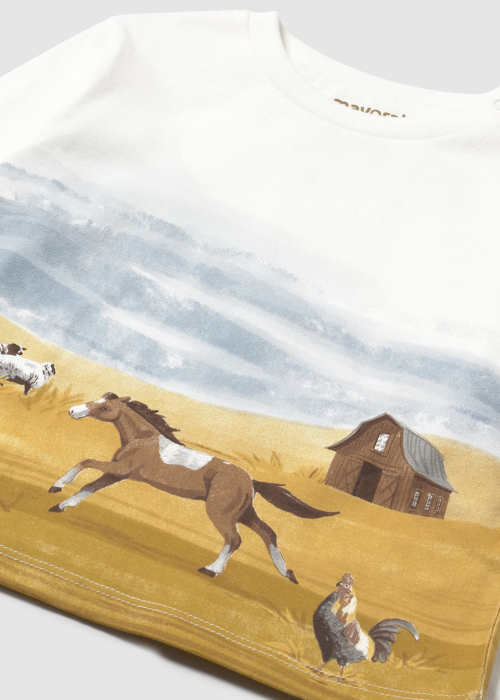 Closeup of farm scene print on 100% cotton jersey.
