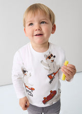 Toddler wearing Ivory animal-print long-sleeve tee, front view, everyday outfit.