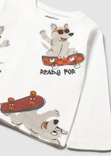 Closeup of animal print graphics on Ivory long-sleeve tee.