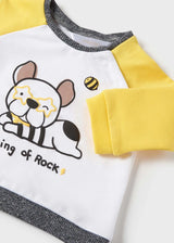 Closeup of shoulder snap buttons and soft knit neckline.