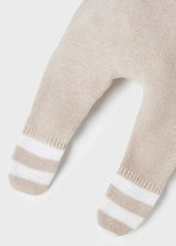 Detail of leg-warmer cuffs and elastic waistband on leggings.