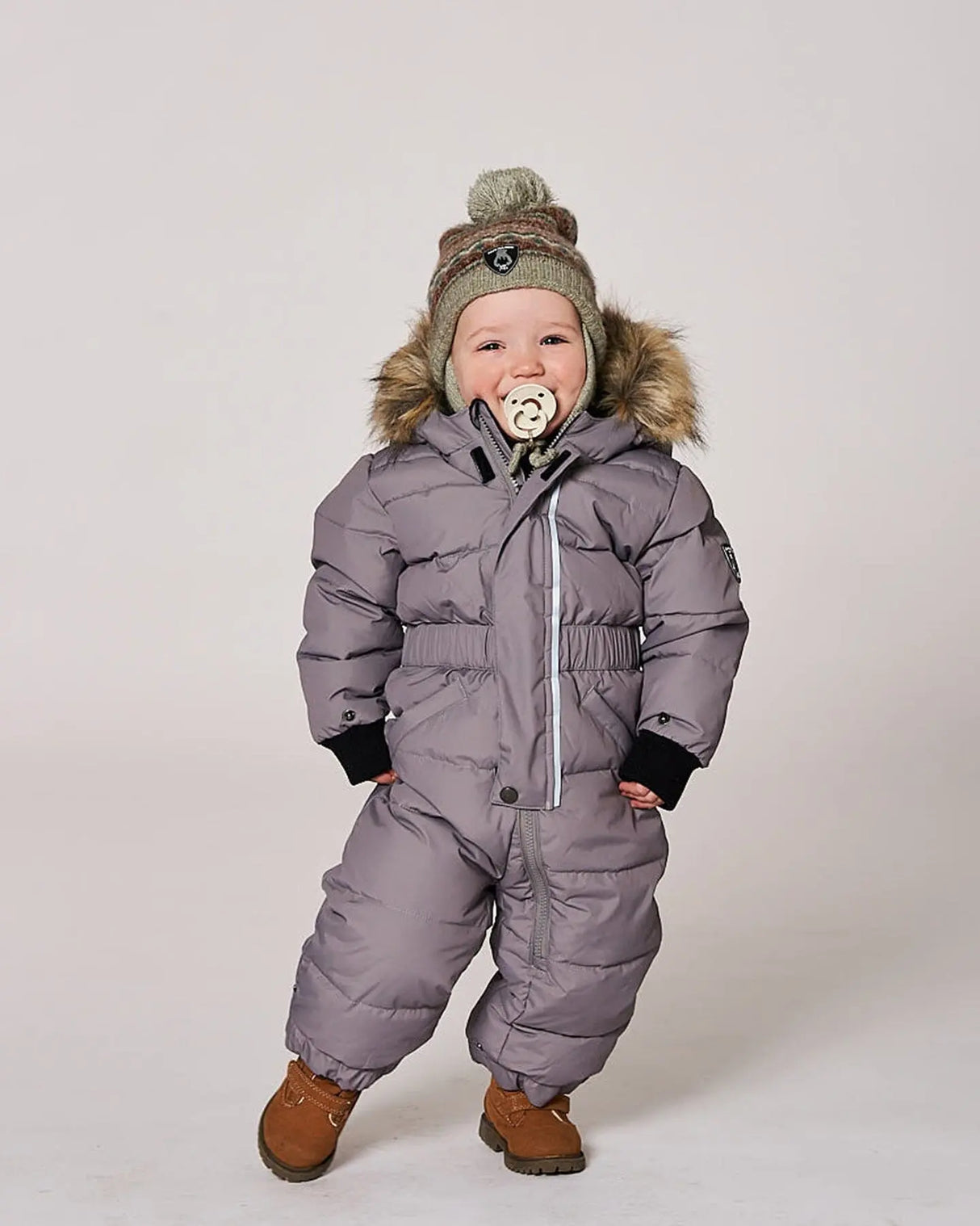 Baby wearing gray puffy snowsuit front view