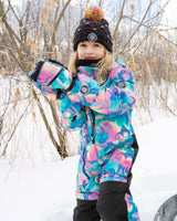 Action shot in colorful one-piece snowsuit, detachable hood and grow sleeves.