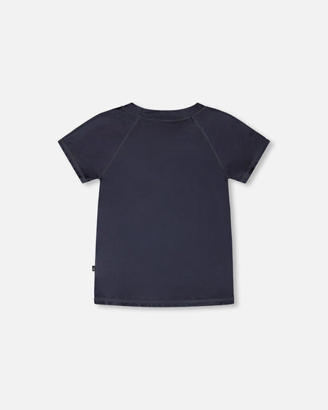 Back view of solid black short sleeve rashguard swim shirt for boys