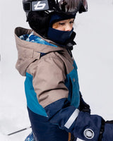 Side view of Teknik snowsuit with helmet-friendly hood and waterproof zippers