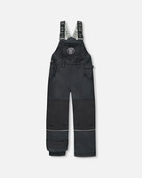 Flat lay of boys Solid Black snow bib overall with reinforced knees.
