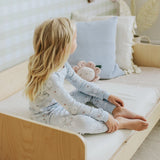 Toddler wearing sky blue hydrangea floral organic cotton pajama set by Petit Lem