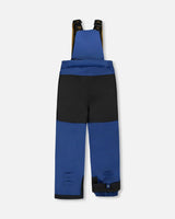 Close-up Cordura® reinforced knee on navy bib pants from Deux Par Deux dinosaur snowsuit