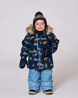 Toddler boy wearing blue/gray jacket and snow pants set with fleece-lined bib.