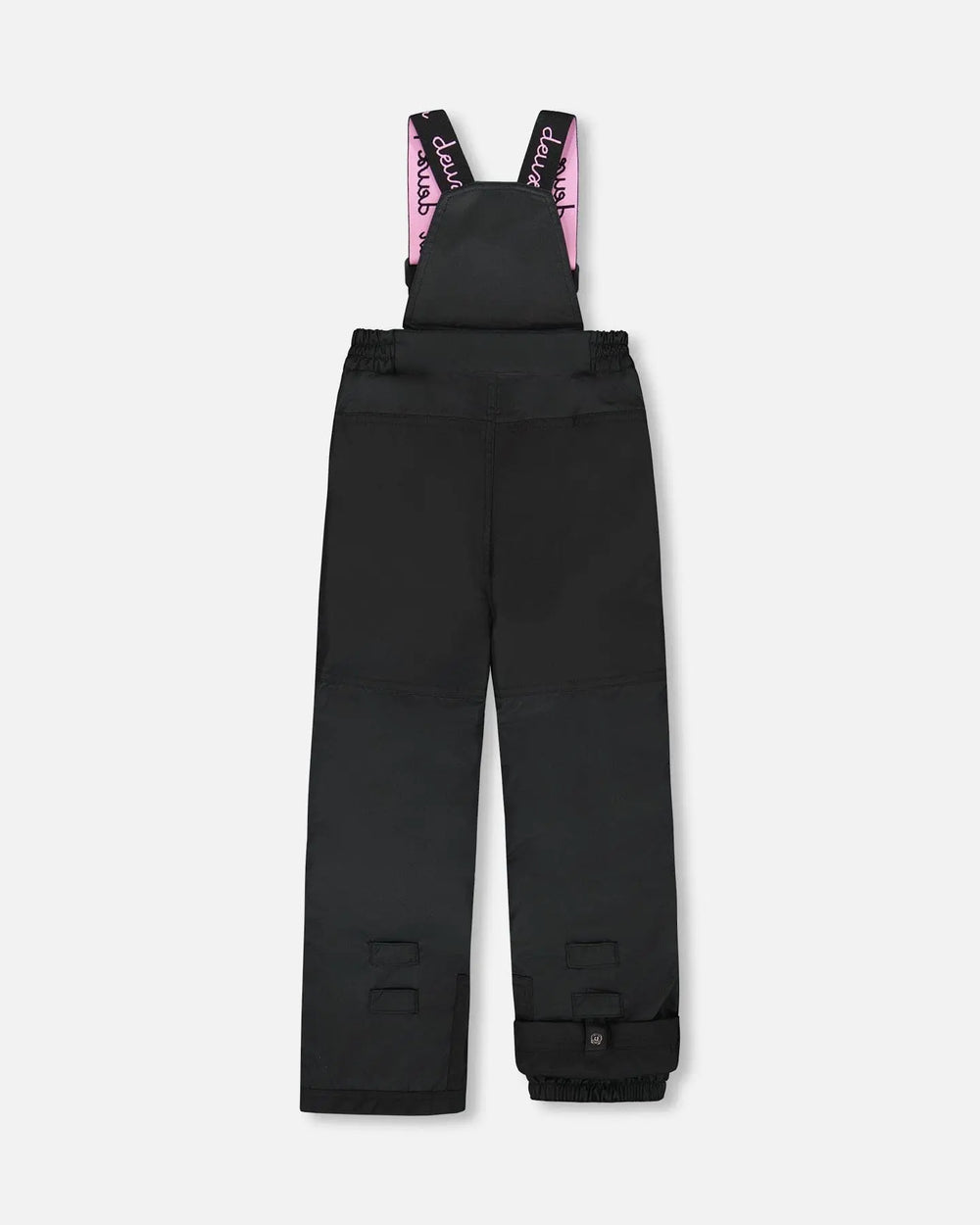 Black bib pants with Cordura knees and ankle gaiters — girls jacket and snow pants.