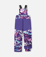 Purple bib pants with Cordura knees and ankle gaiters, two-piece ski suit.