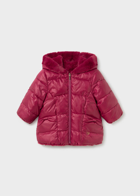 Front view of the Mayoral baby girl reversible puffer jacket in raspberry with a faux fur lined hood