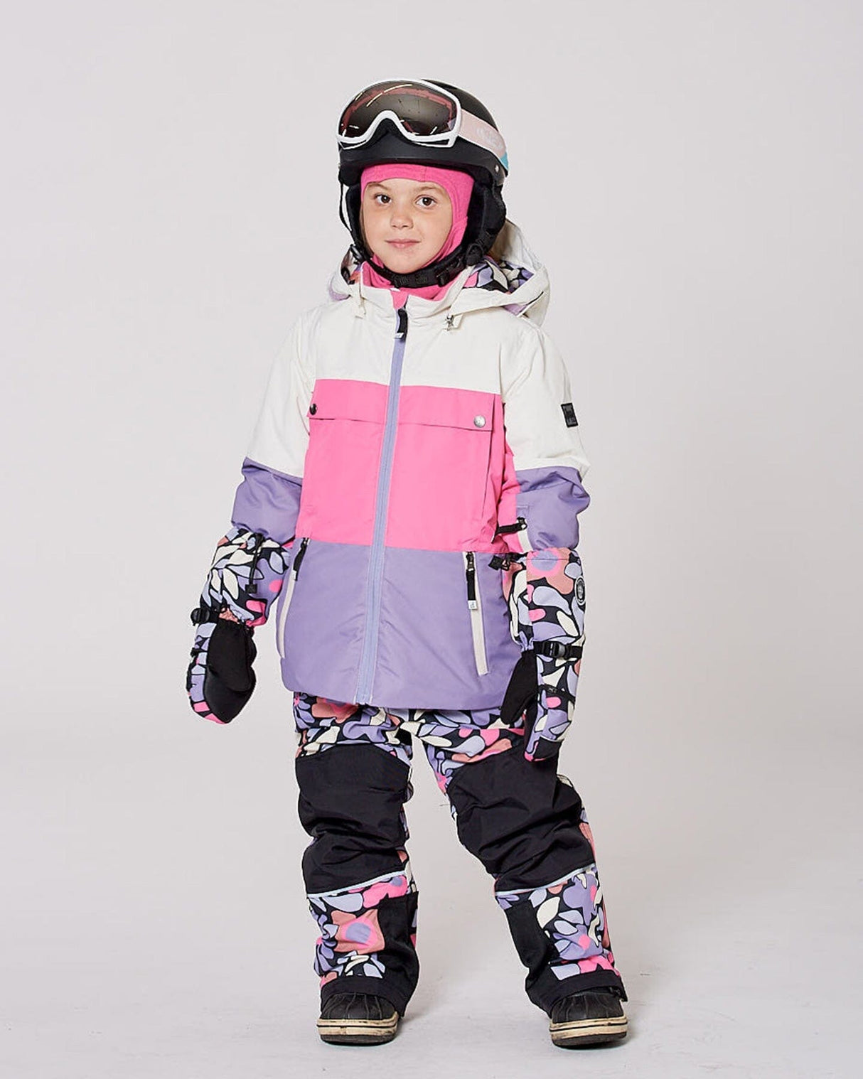 child in Teknik snowsuit showing adjustable hems and suspenders
