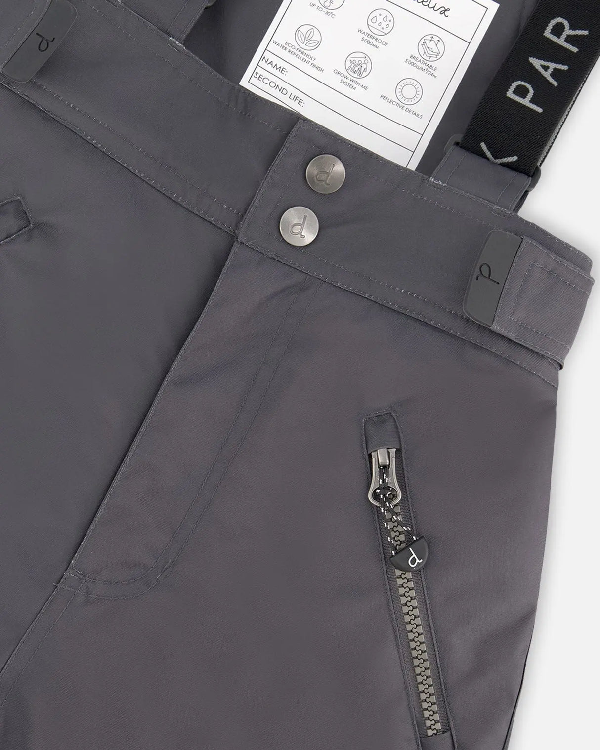 Close-up Cordura reinforced knee and zipper on dark gray snow pants
