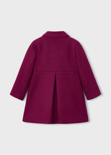Back of the raspberry coat with a box pleat