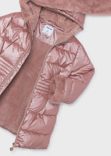 Close-up of the open pink puffer jacket with pink lining, faux fur cuff and heart-shaped zipper pull