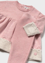 Close-up of Mayoral newborn girl outfit set showing Pink cotton dress, matching leggings, and Cream cuffs.