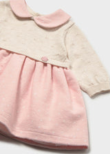 Close-up of Mayoral newborn girl knit dress showing Pink collar, Ivory knit bodice, and soft Pink skirt.