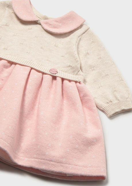 Close-up of Mayoral newborn girl knit dress showing Pink collar, Ivory knit bodice, and soft Pink skirt.